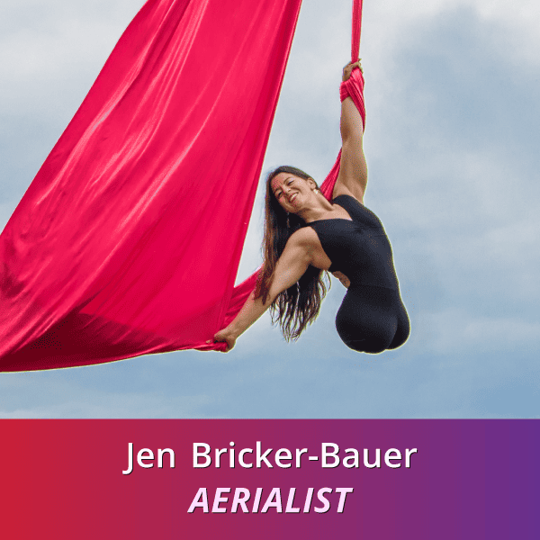 Jen Bricker-Bauer: Aerialist, a Caucasian woman born without legs who is wearing black as he uses hot pink aerial silks to soar in the sky