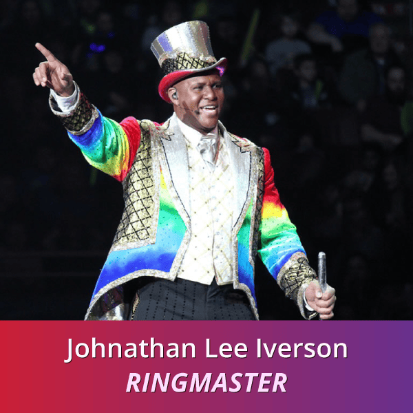 Johnathan Lee Iverson: Ringmaster, a black man wearing a sparkly rainbow ringmasters outfit pointing upwards